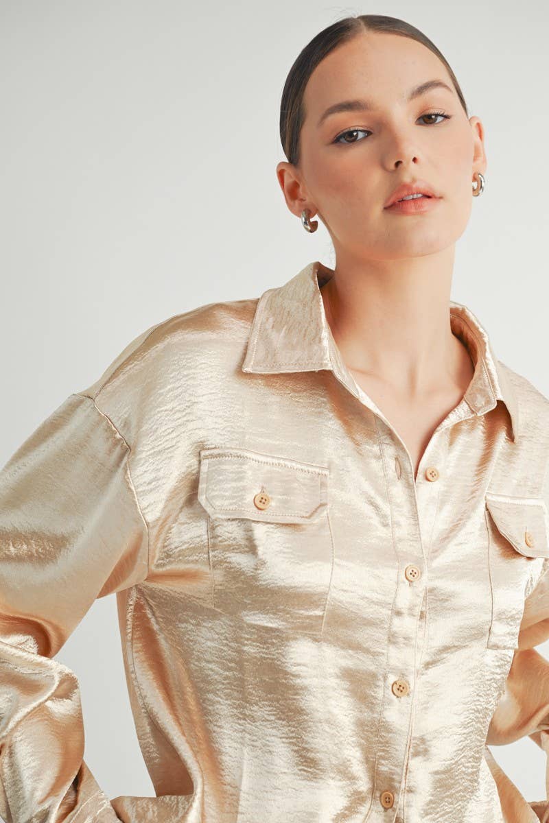 Champagne satin button-down shirt with a relaxed fit, two front pockets, and a subtle sheen.