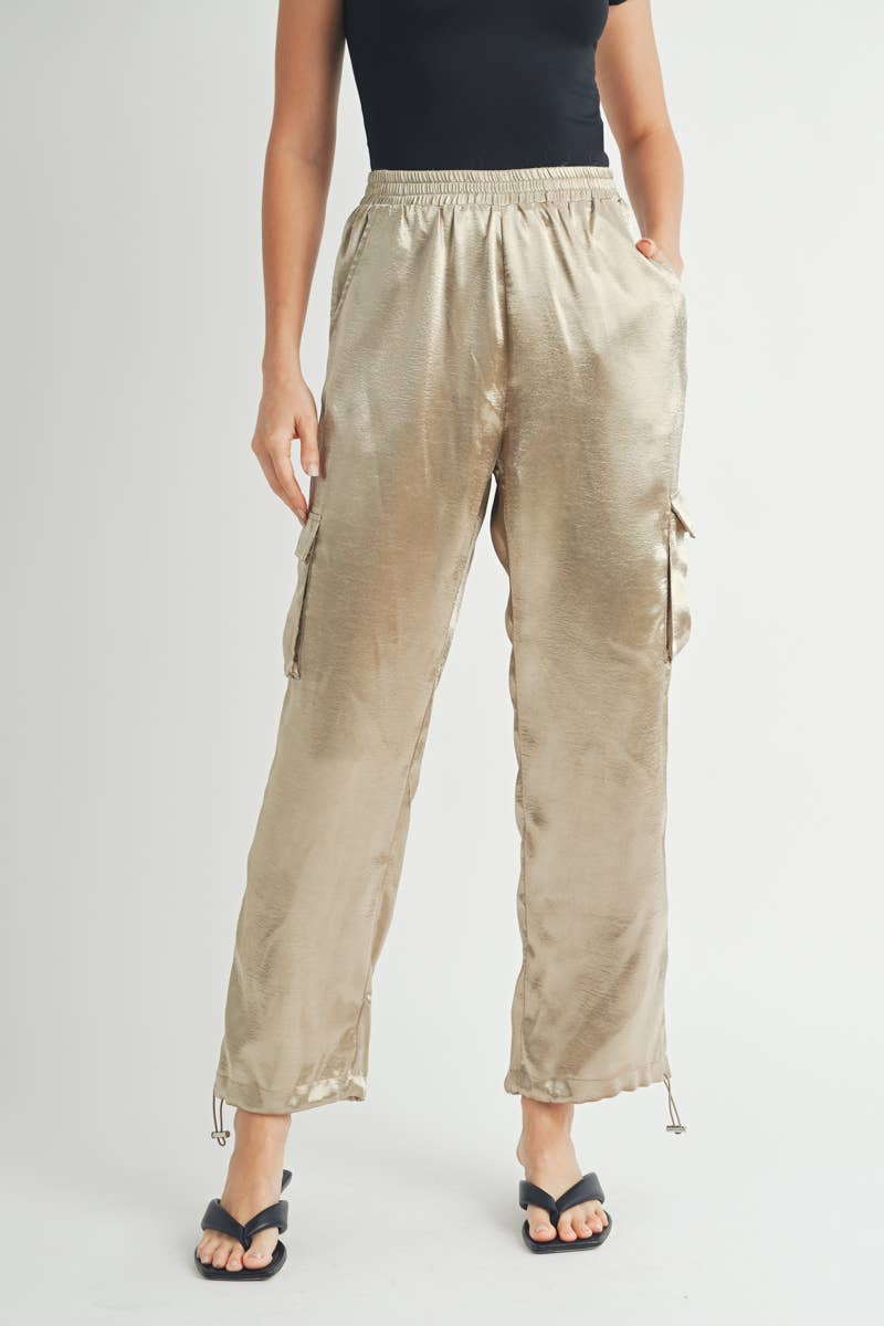 Back of Gold Satin Cargo Pants with Adjustable Drawstring Hem where its open on bottom 